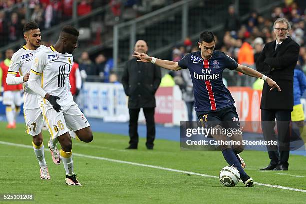 Javier Pastore of Paris Saint-Germain controls the ball against Ibrahim Amadou of Losc during the Coupe de la Ligue Final game between Paris...