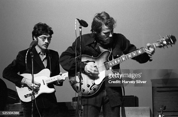 Robbie Robertson and Levon Helm of The Band perform during a concert at Queens College in New York.