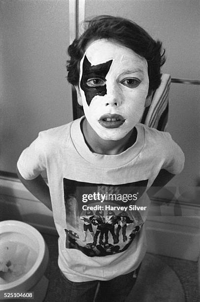 An 11-year-old KISS fan poses in his Paul Stanley makeup on Halloween.