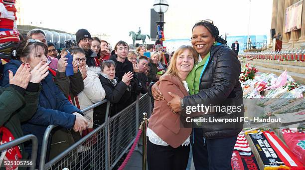 Margaret Aspinall, and lawyer for 77 of the 96 families, Marcia Willis Stewart , embrace as the crowd applaud after the Hillsborough Vigil on April...