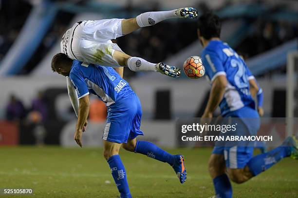 Argentina's Racing Club defender Nicolas Sanchez vies for the ball with Brazil's Atletico Mineiro forward Lucas Pratto during their Copa Libertadores...