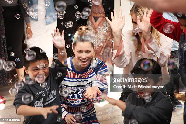 Actress Jessica Biel and model/co-president of Baby2Baby Kelly Sawyer Patricof interact with guest during the Baby2Baby Mother's Day Party presented...