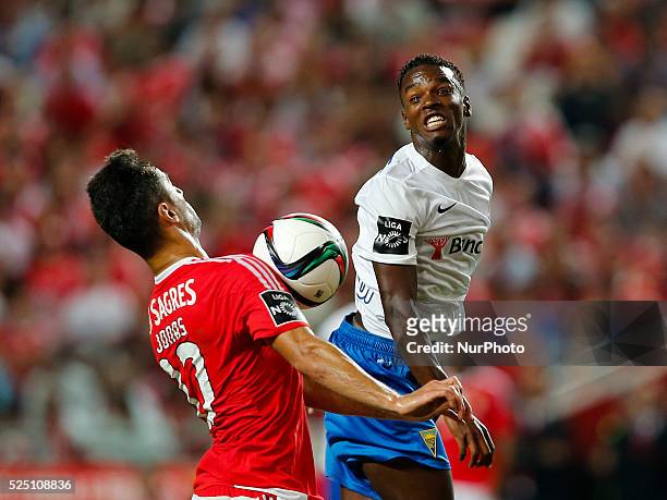 Benfica's forward Jonas heads for the ball with Estoril's defender Mano during the Portuguese League football match between SL Benfica and Estoril...