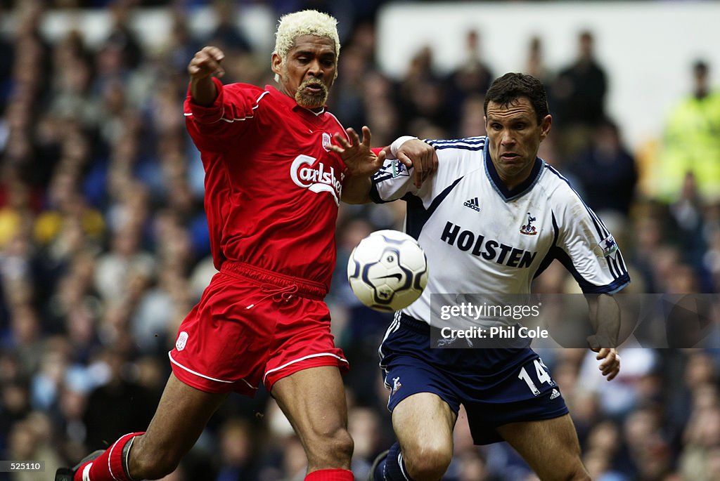 Gustavo Poyet of Tottenham Hotspur and Abel Xavier of Liverpool