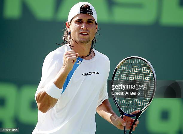 David Ferrer of Spain celebrates a point over Dominik Hrbaty of Slovakia during the NASDAQ-100 Open at the Crandon Park Tennis Center on March 30,...