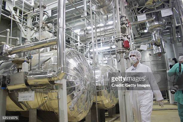 Worker walks inside of an uranium conversion facility March 30, 2005 just outside the city of Isfahan, about 254 miles , south of capital Tehran,...