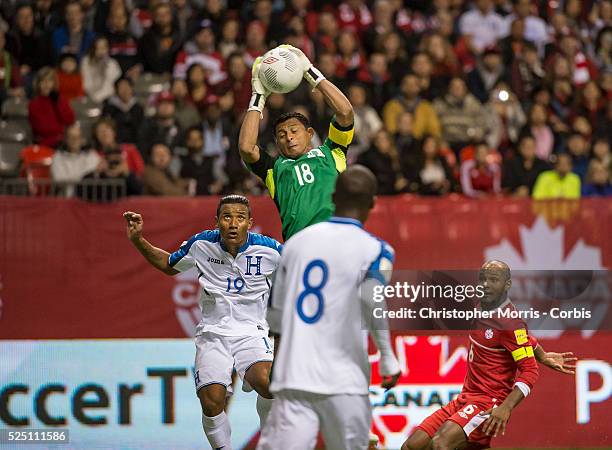 World Cup 2018 - Luis Garrido of Honduras watches as Noel Valladares, goalkeeper, of Honduras makes a leaping save in front of Julian de Guzman , of...