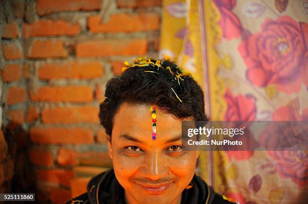 Portrait of brother after applying Seven layers of colorful vermilion powder on a brothers forehead by sister on the fifth and last day of Tihar is...