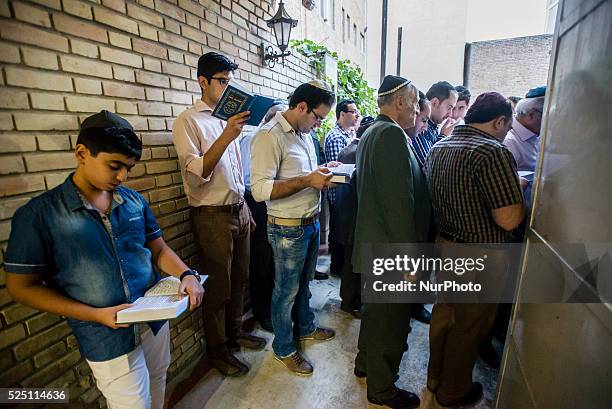 Jewish men read the Torah on Rosh Hashanah, Jewish New Year, in Yusef Abad Synagogue, one of the biggest in Northern Tehran, Iran