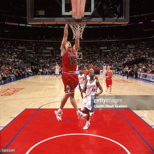 Kirk Hinrich of the Chicago Bulls makes a dunk against the Los Angeles Clippers at Staples Center on March 13, 2004 in Los Angeles, California. The...