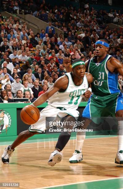 Marcus Banks of the Boston Celtics drives past Jason Terry of the Dallas Mavericks March 30, 2005 at the Fleet Center in Boston, Massachusetts. NOTE...