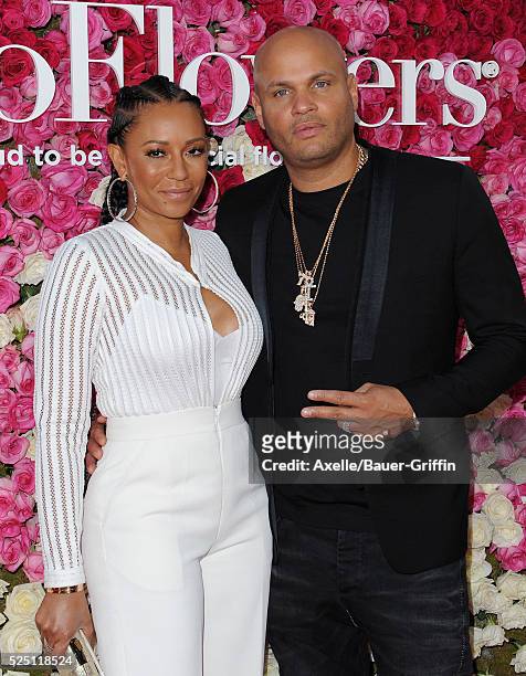 Singer Mel B and producer Stephen Belafonte arrive at the Open Roads World Premiere Of 'Mother's Day' at TCL Chinese Theatre IMAX on April 13, 2016...