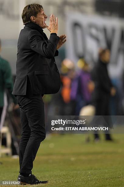 Argentina's Racing Club coach Facundo Sava gestures during the Copa Libertadores 2016 round before the quarterfinals first leg match against Brazil's...