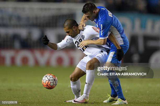 Argentina's Racing Club defender Ivan Pillud vies for the ball with Brazil's Atletico Mineiro forward Clayton during their Copa Libertadores 2016...