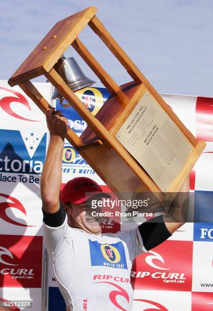 Trent Munro of Australia hold aloft the Bells Trophy after winning the final of the Rip Curl Pro, which is round two of the ASP World Championship...