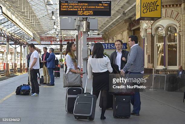 People waiting for the arrival of a train at Crewe station on Thursday 4th June 2015. Crewe station is a junction and hub of the West Coast Main...