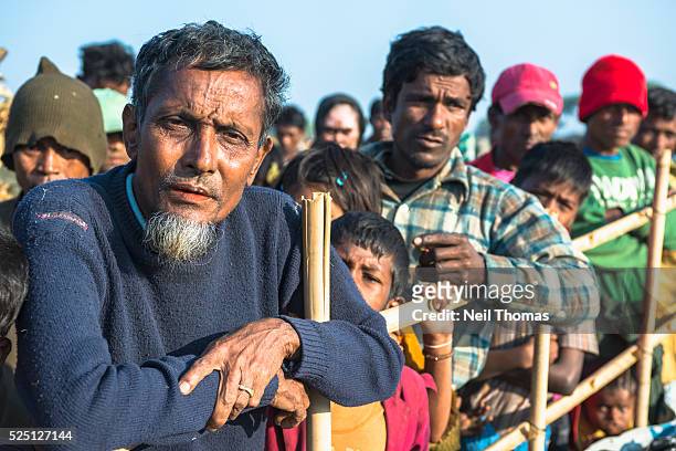 Raza Miah, 55 from Than Taw Li village waits for rice to be distributed at an unregistered Internally Displaced People's camp near Sittwe, Rakhine...
