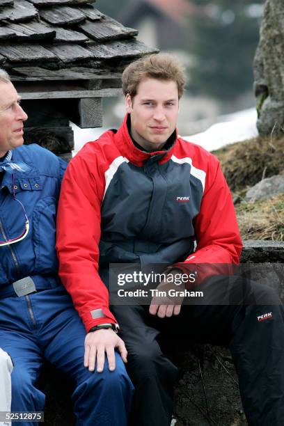 Prince William with his hand on Prince Charles's knee at a photocall during the Royal Family's ski break in the region at Klosters on March 31, 2005...