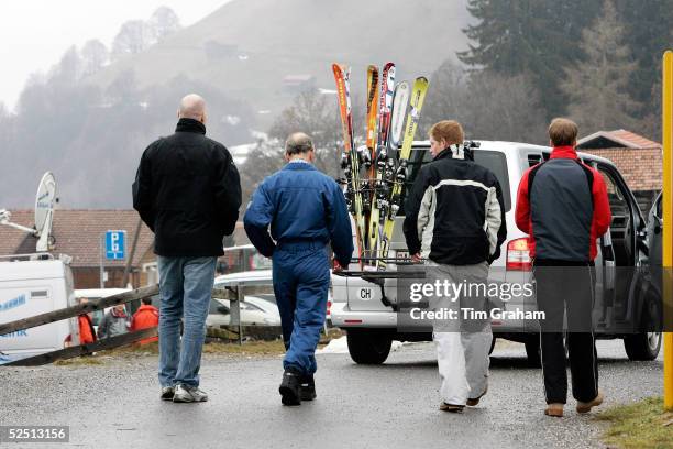 Prince Charles with Prince William, Prince Harry and Paddy Harveson, Communications Director leaving a photocall where he was overheard muttering...