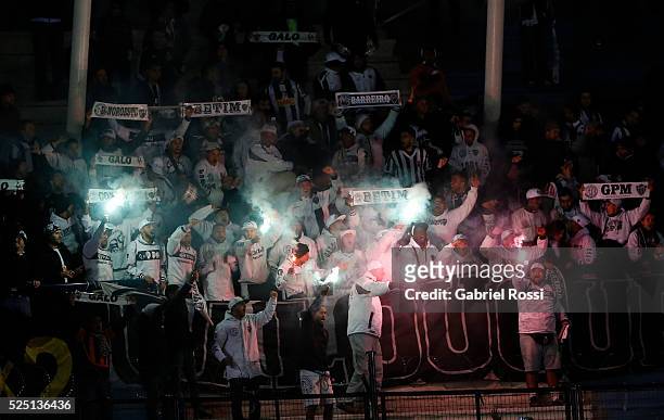 Fans of Atletico Mineiro cheer for their team during a first leg match between Racing Club and Atletico Mineiro as part of round of 16 of Copa...