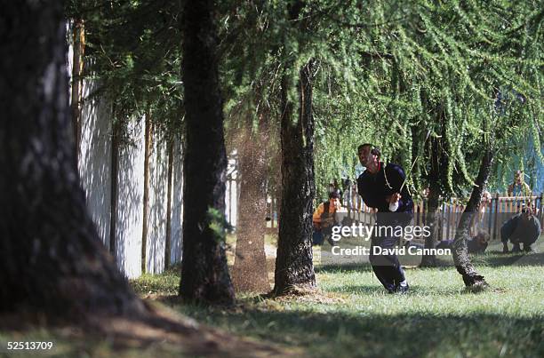 Seve Ballesteros of Spain plays a miracle shot on the 18th hole to set up a birdie finish during the final round of the European Masters at Crans Sur...