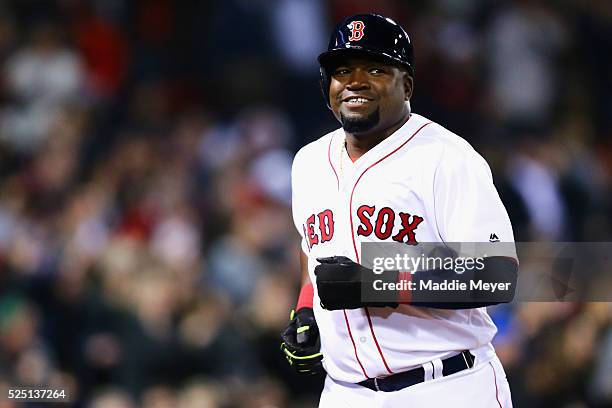 David Ortiz of the Boston Red Sox reacts after scoring a run against the Atlanta Braves during the fourth inning on April 27, 2016 in Boston,...