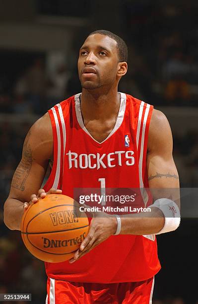 Tracy McGrady of the Houston Rockets shoots a free throw against the Washington Wizards during the game on March 2, 2005 at MCI Center in Washington...