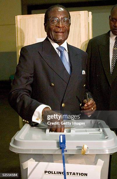 Zimbabwean president Robert Mugabe casts his vote in the country's presidential elections on March 31, 2005 in Harare, Zimbabwe. Mugabe has made know...