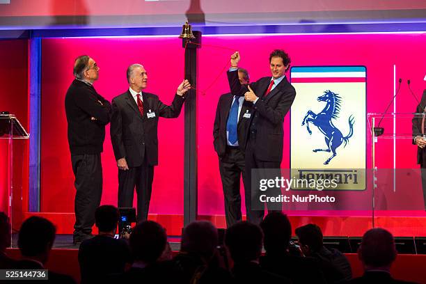 S chairman John Elkann, FCA's chief executive Sergio Marchionne and Piero Ferrari, vice chairman and son of the founder Enzo ring the bell in Milan...