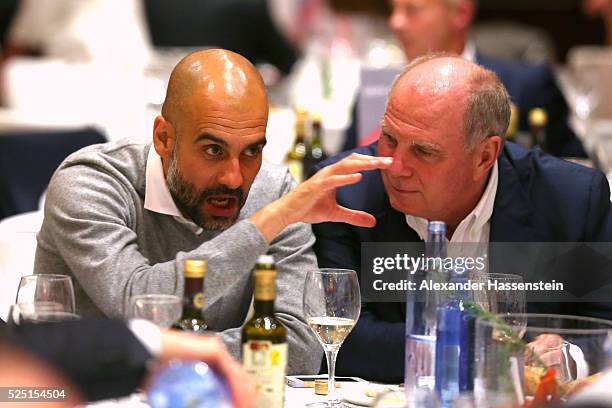 Josep Guardiola , head coach of Muenchen talks to Uli Hoeness during the Champions Banquette after the UEFA Champions League semi final first leg...