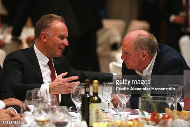 Karl-Heinz Rummenigge , CEO of Bayern Muenchen talks to Uli Hoeness during the Champions Banquette after the UEFA Champions League semi final first...