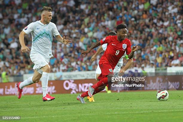 Slovenian Jasmin Kurtic and England forward Raheem Sterling UEFA EURO 2016 Group E qualifier between Slovenia and England at sport park Stozice,...