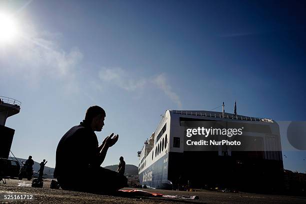 Refugees and migrants wait at the port of Mytilene for the 48-hour strike of the dock workers to end so they can get in the ferries and head to the...