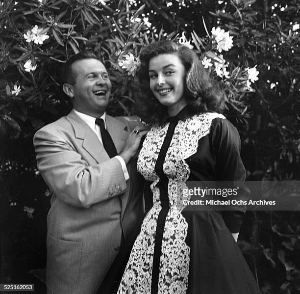 Actress Elaine Stewart with radio personality Johnny Grant attend the Garden party by Jimmy McHugh in Los Angeles,CA.