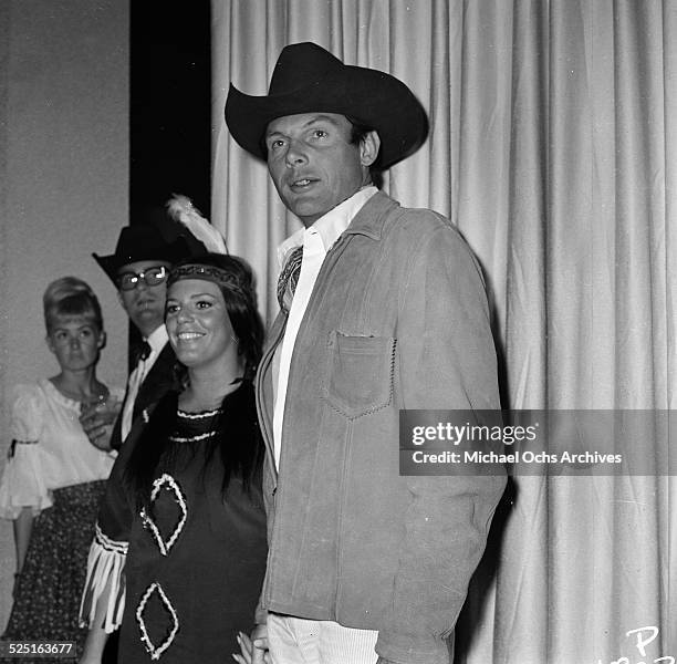 Actor Adam West with Judy Smith attends a costume party in Los Angeles,CA.