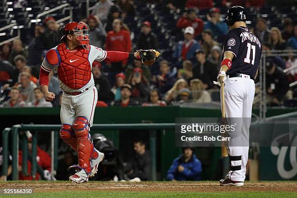 Catcher Carlos Ruiz of the Philadelphia Phillies looks back the umpire after Ryan Zimmerman of the Washington Nationals was called out looking for...