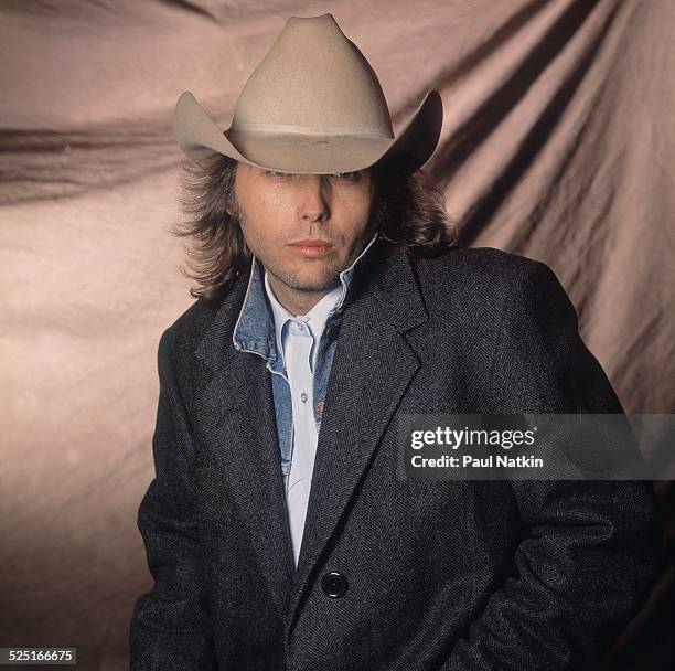 Portrait of country musician Dwight Yoakam at Farm Aid, Ames, Iowa, April 4, 1990.