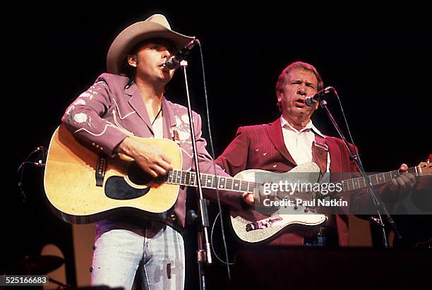 Country musicians Dwight Yoakam and Buck Owens perform together at the Chicago Theater, Chicago, Illinois, August 5, 1988.