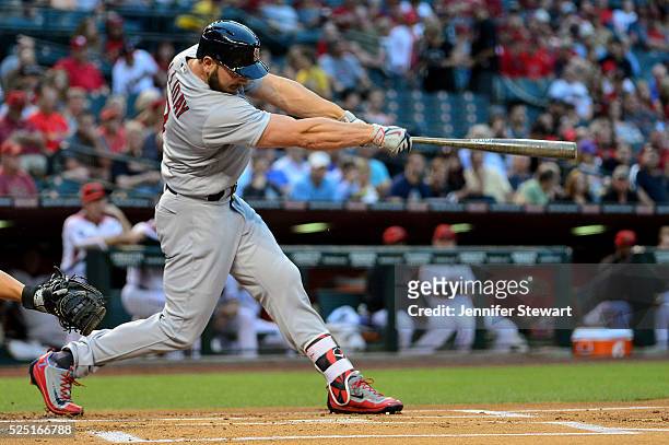 Matt Holliday of the St. Louis Cardinals hits a ball resulting in a run scored on a fielding error in the first inning against the Arizona...