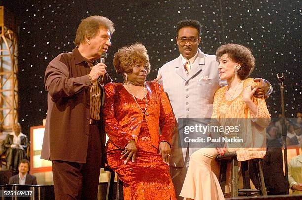 From left, gospel musicians Bill Gaither, Albertina Walker, unidentified, and Dottie Rambo perform onstage, Dallas, Texas, March 11, 2003.