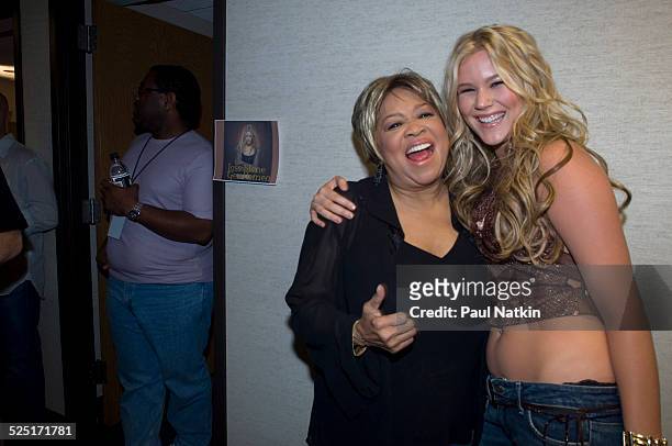 Musicians Mavis Staples and Joss Stone pose together backstage at WTTW television, Chicago, Illinois, August 24, 2005.