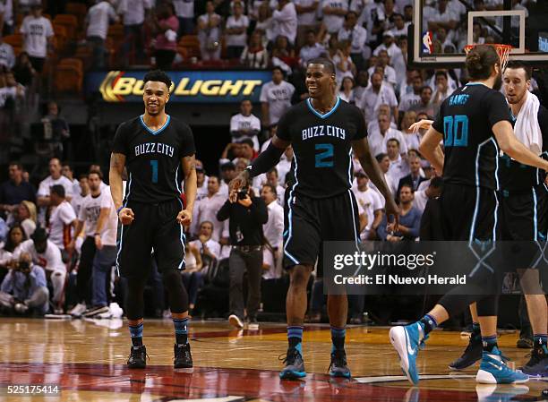 Charlotte Hornets guard Courtney Lee and Marvin Williams celebrate after they beat the Miami Heat 90-88 on Wednesday, April 27 at AmericanAirlines...