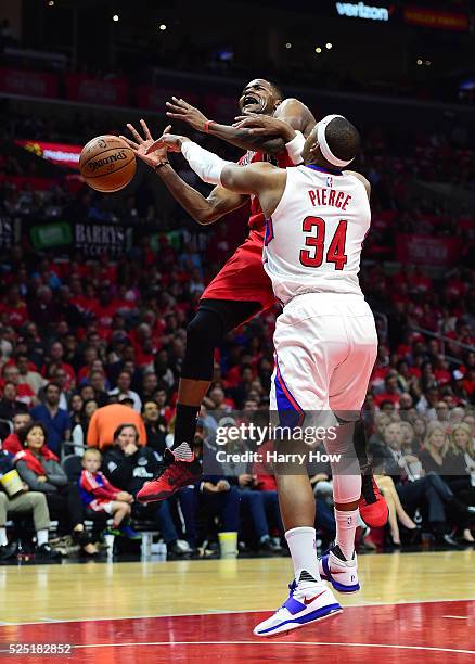 Maurice Harkless of the Portland Trail Blazers is fouled on a layup by Paul Pierce of the Los Angeles Clippers in Game Five of the Western Conference...