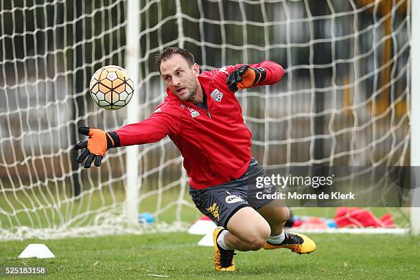 Eugene Galekovic makes a save during an Adelaide United A-League training session at the Adelaide United Training Centre on April 28, 2016 in...