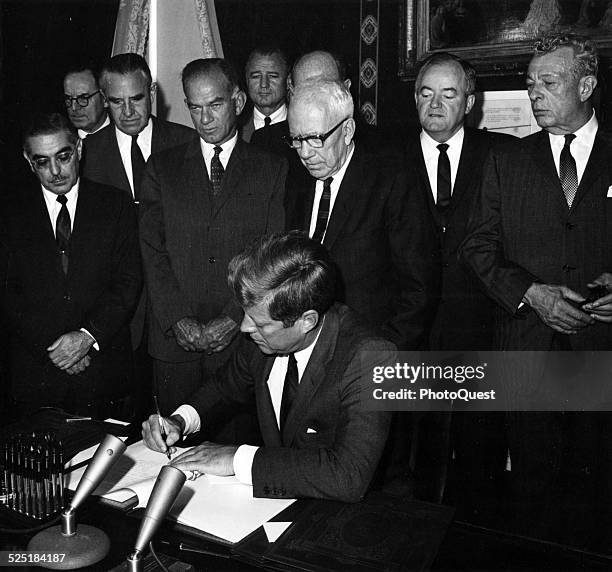 President John F Kennedy signs the instruments of ratification of the limited Nuclear Test Ban Treaty at the White House, Washington DC, October 7,...
