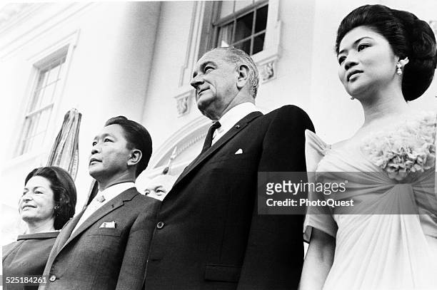 President Lyndon Johnson and his wife, First Lady Ladybird Johnson, pose with Philippine President Ferdinand Marcos and his wife, Imelda Marcos,...