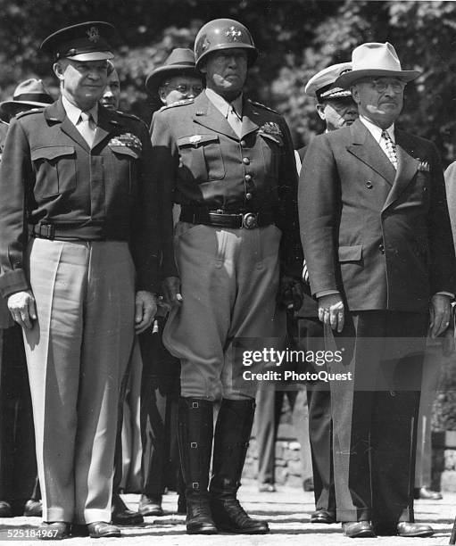 President Harry S Truman stands with General George S Patton and General Dwight D Eisenhower during a special flag-raising ceremony, Berlin, Germany,...