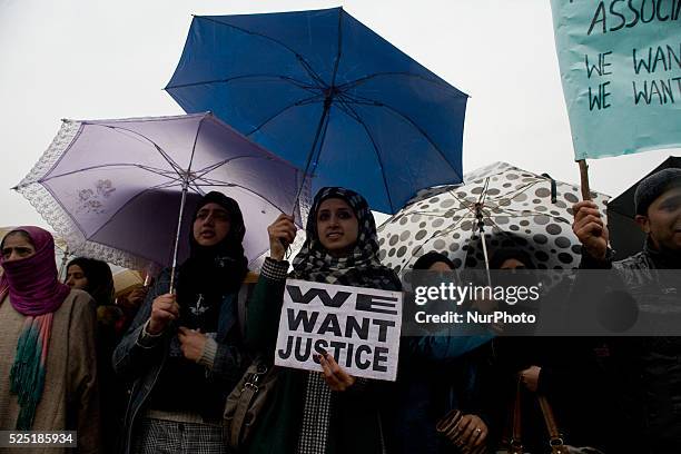 Kashmiri contractual teacher holds a placard during a protest demonstration on 18, 2015 in Srinagar, the summer capital of Indian administered...