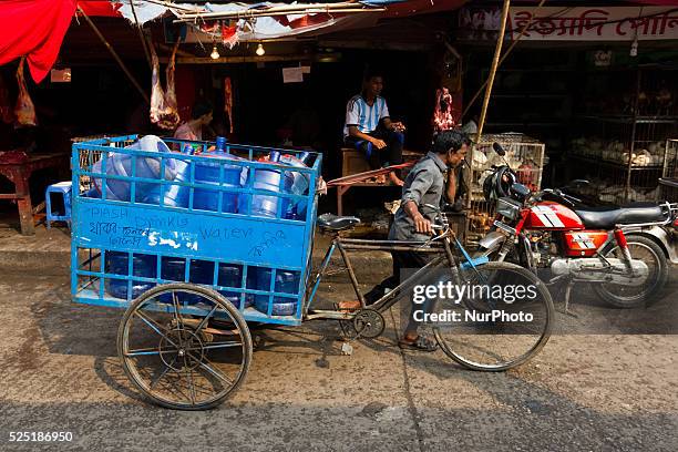 Man pulling his cart on February 27, 2015 at Bandarbazar in Sylhet, Bangladesh.