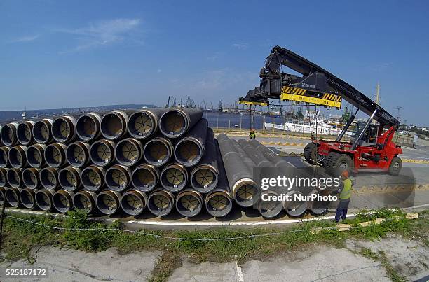 Workers arrange pipes delivered for construction of the South Stream gas pipeline at the Black sea harbour of Varna some 450 kms east of the...